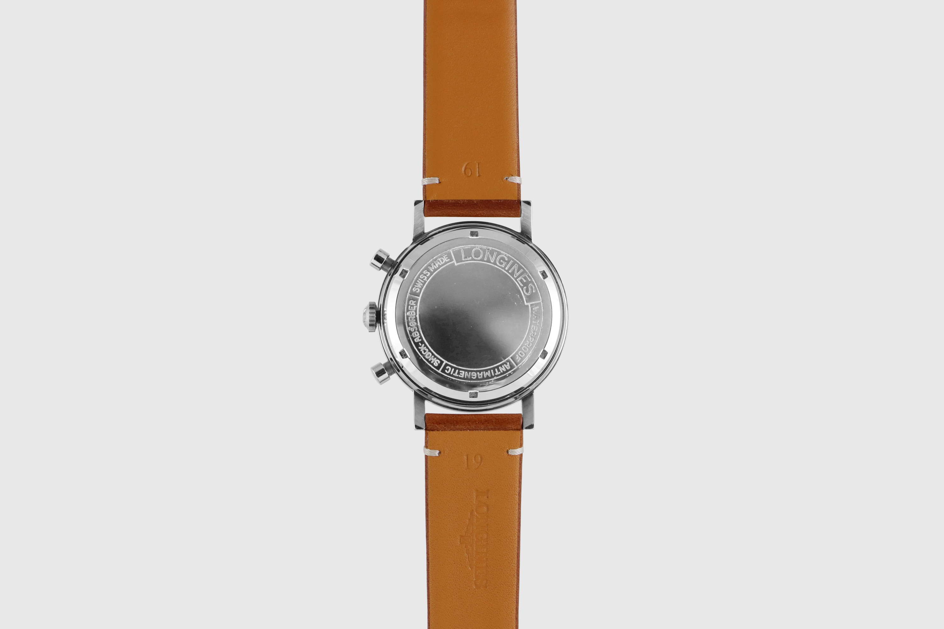Longines 7413. Closed caseback. · Photo: Longines · © Longines; permission not recorded · Source: https://www.longines.com/en-my/p/watch-longines-flyback-chronograph-30ch-1965-7413-13333446