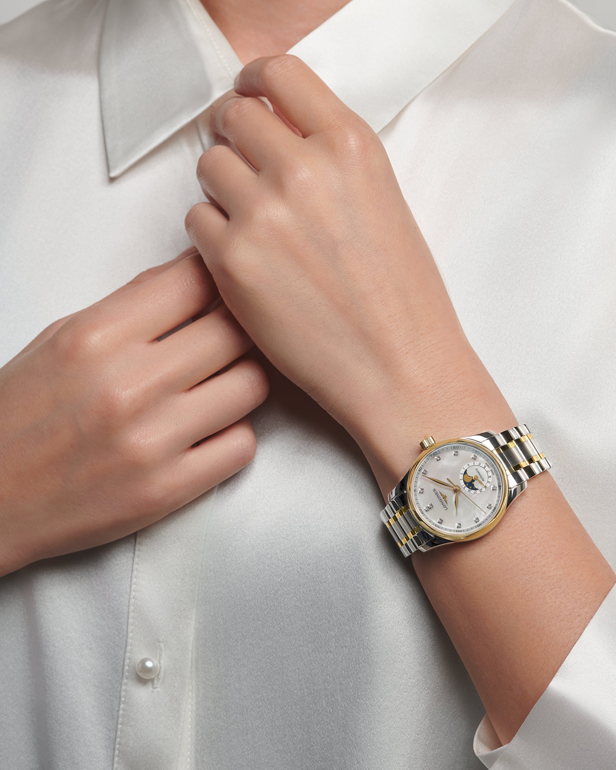 Longines MASTER COLLECTION MOONPHASE automatic stainless steel and 18 karat yellow gold cap 200 Watch - L2.409.5.87.7