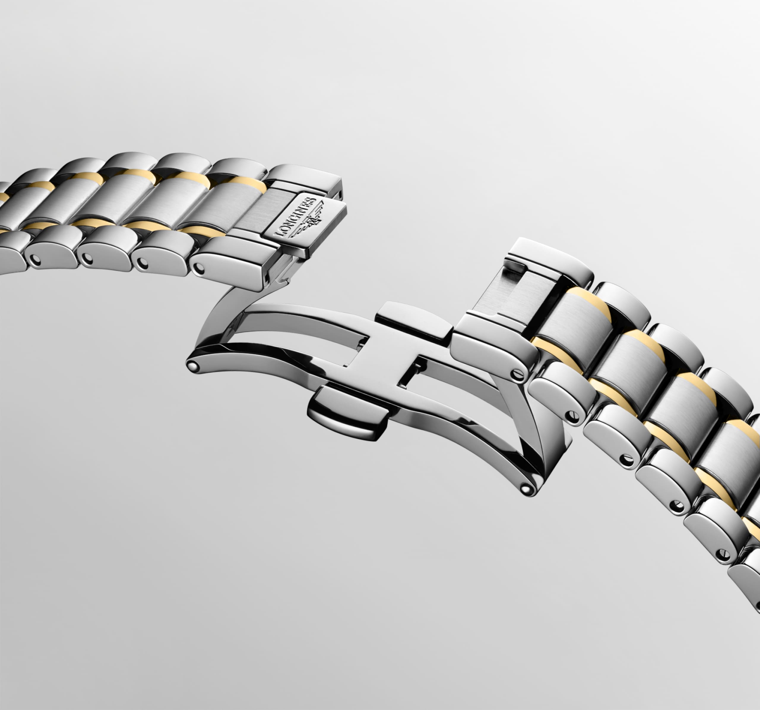 THE LONGINES MASTER COLLECTION L2.450.5.87.7 Automatic, Stainless steel and 18 karat yellow gold cap 200, White mother-of-pearl, Bracelet Watch - Buckle